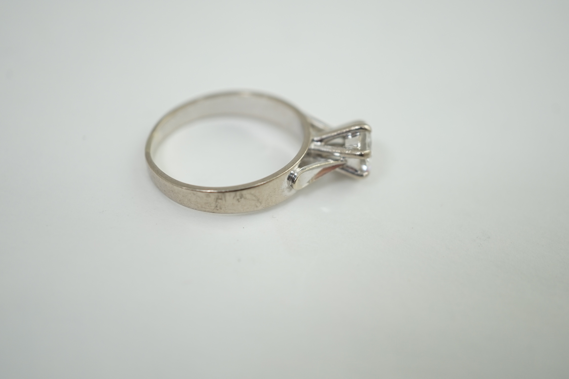 A late 20th century 18ct white gold and solitaire diamond set ring